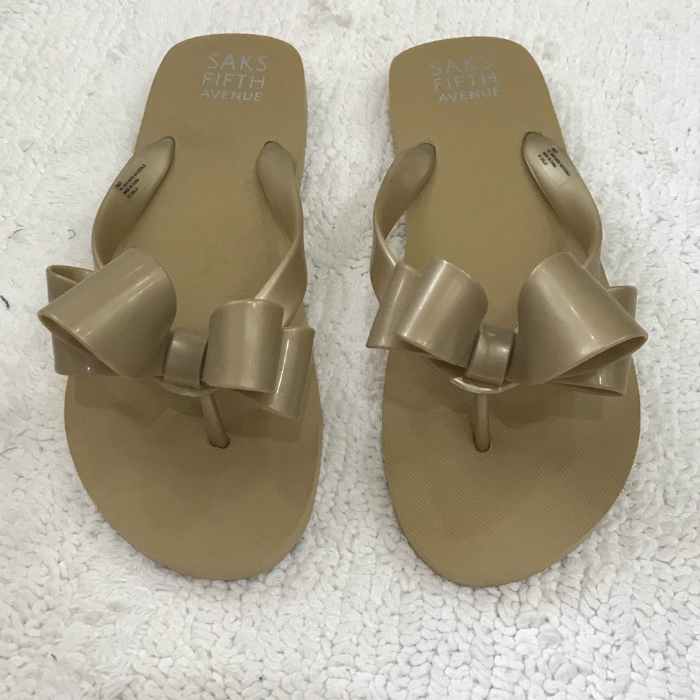 Saks Fifth Avenue Gold Bow Flip-Flops, size 7.